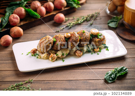 Portion of vegetarian falafels with mushrooms 102134889