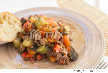 dish of vegetable stew. stewed eggplant, minced meat, carrots, peppers, onion squid 102136278