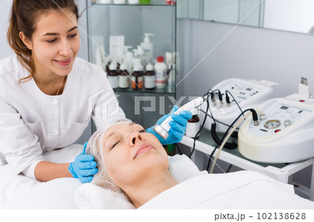 Mature woman having beauty procedures Mature woman having beauty procedures 102138628
