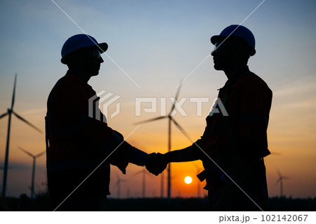 Engineers technicians working with teamwork at wind turbine field Engineers technicians working with teamwork at wind turbine field 102142067