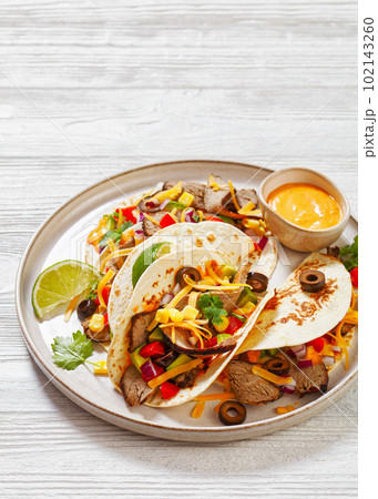 Beef Steak Tacos with veggies, avocado, corn Beef Steak Tacos with veggies, avocado, corn 102143260