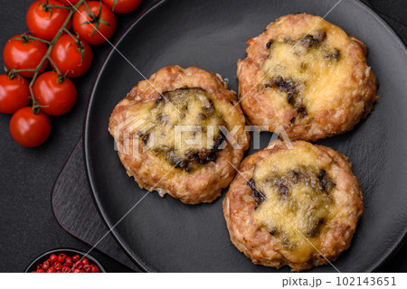 Delicious baked meat boats with mushrooms, cheese, salt and spices 102143651