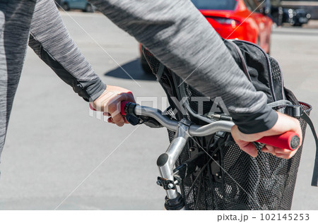 Portrait of a hipster man. A man in a big city cycling down the street on a bicycle, a life style concept Portrait of a hipster man. A man in a big city cycling down the street on a bicycle, a life style concept 102145253