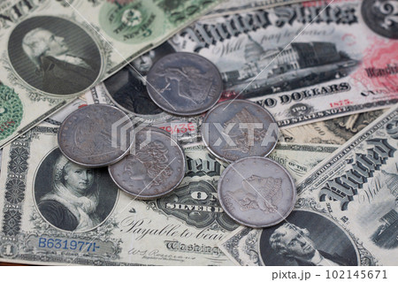 Old US banknotes and silver certificates with silver dollar coins Old US banknotes and silver certificates with silver dollar coins 102145671