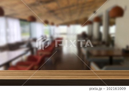 Cafe bar blurred background. Wooden table on cafe. Cafe bar blurred background. Wooden table on cafe. 102161009