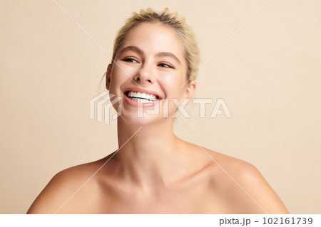 Beautiful smile of young woman with healthy white teeth on beige background, Dental care. Dentistry concept. Beautiful smile of young woman with healthy white teeth on beige background, Dental care. Dentistry concept. 102161739