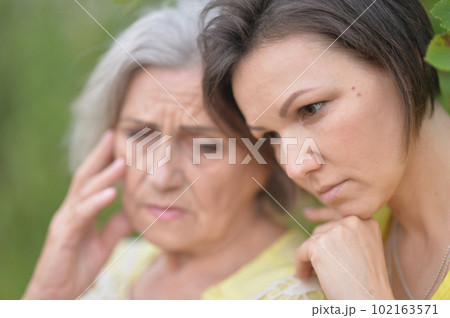 Elderly woman with her daughter walking in summer 102163571
