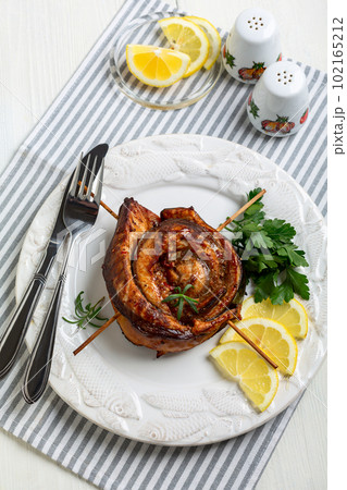 Baked mackerel fillet in the form of a roll. 102165212