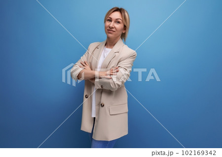 portrait of a confident white-haired young woman in a business outfit on a studio background portrait of a confident white-haired young woman in a business outfit on a studio background 102169342