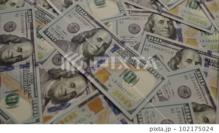 Closeup background of US Currency in 100 dollar banknotes Closeup background of US Currency in 100 dollar banknotes 102175024