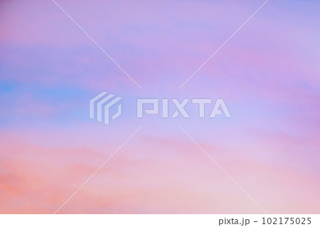 Sky with soft and fluffy pastel orange pink and blue colored clouds. Sunset background. Nature. sunrise. Sky with soft and fluffy pastel orange pink and blue colored clouds. Sunset background. Nature. sunrise. 102175025