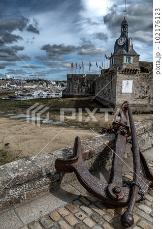 Big Anchor At Harborbridge Of Ancient City Concarneau With Medieval Stronghold At The Finistere Atlantic Coast In Brittany, France 102176123