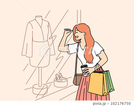 Smiling woman shopping looking in showcase Smiling woman shopping looking in showcase 102176750