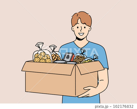 Smiling volunteer with box of food donate at crisis center Smiling volunteer with box of food donate at crisis center 102176832