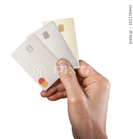 Lodz, Poland February 05 2023 Hand holding plastic bank credit cards with mastercard logo isolated on white background 102176942