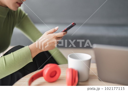 Happy young asian woman texting messaging on mobile phone, smiling girl use cellphone chatting, browse wireless internet on gadget Happy young asian woman texting messaging on mobile phone, smiling girl use cellphone chatting, browse wireless internet on gadget 102177115