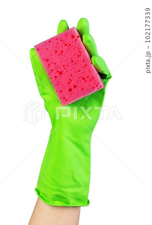 Hand in green glove holding washing sponge of red pink color isolated on white background Hand in green glove holding washing sponge of red pink color isolated on white background 102177339