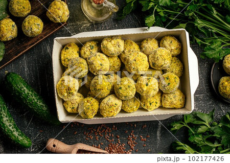 Portion of packed falafels in a box 102177426