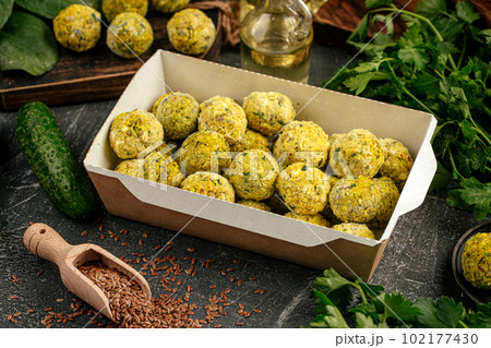 Portion of packed falafels in a box 102177430