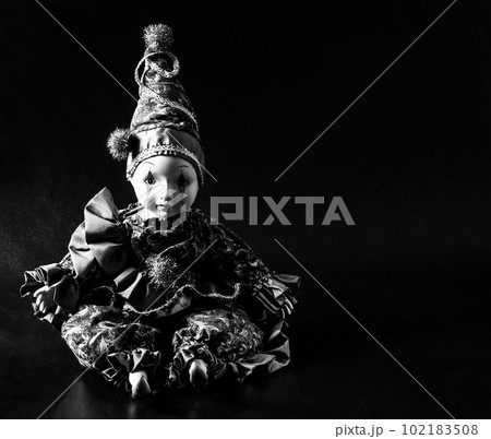 Amazing realistic porcelain doll, toy, harlequin, selective focus, vintage concept	 102183508
