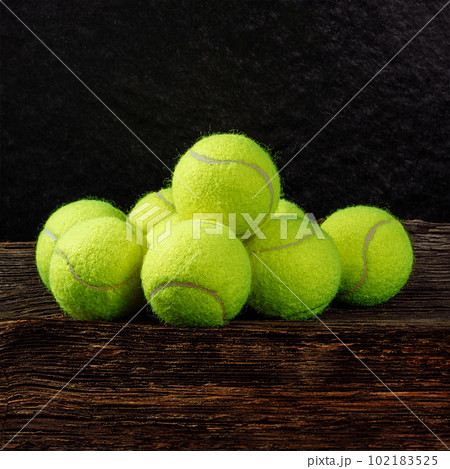 Tennis balls on wooden background, sport concept, rustic style, stock photo, space for text Tennis balls on wooden background, sport concept, rustic style, stock photo, space for text 102183525