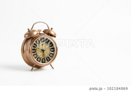 Old vintage alarm on a white background, space for text	 102184869