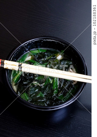 Japanese soup and sticks on wooden table 102188361