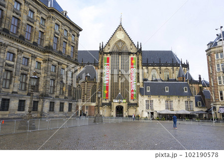 Amsterdam, Netherlands - Nov 29, 2019 : New church on the Dam Square in the winter with blue sky in Amsterdam, Netherlands on Nov 29, 2019. Amsterdam, Netherlands - Nov 29, 2019 : New church on the Dam Square in the winter with blue sky in Amsterdam, Netherlands on Nov 29, 2019. 102190578