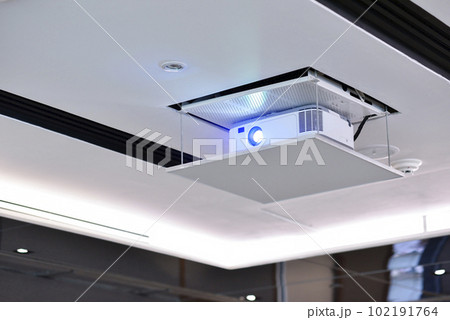 Projector on the ceiling in conference room. Projector on the ceiling in conference room. 102191764