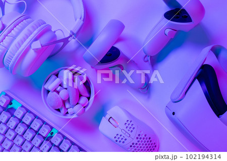 Keyboard with marshmallows and accessories on desk 102194314