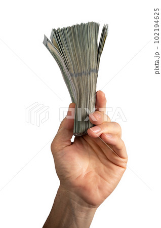 Hand holding dollar bills stack, money, bank notes, us banknotes isolated on white background Hand holding dollar bills stack, money, bank notes, us banknotes isolated on white background 102194625