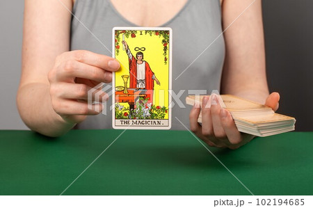 Lodz Poland April 15 2023 Magician arcana, hand holding showing tarot card during divination 102194685