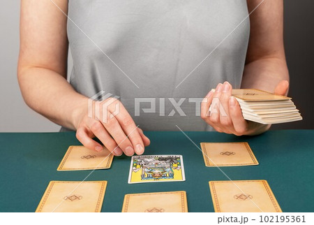 Lodz, Poland April 07 2023 Tarot reader teller spreading taro cards, pentagram divination, reading future, fortune telling Lodz, Poland April 07 2023 Tarot reader teller spreading taro cards, pentagram divination, reading future, fortune telling 102195361