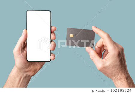 Mobile phone mock-up and bank credit card mockup in male hand isolated on white background 102195524