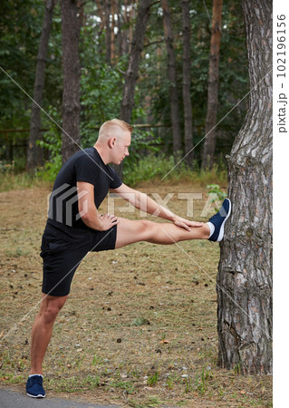 young athlete running in the forest young athlete running in the forest 102196156