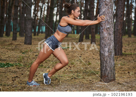 Young woman running outdoors in a city park Young woman running outdoors in a city park 102196193