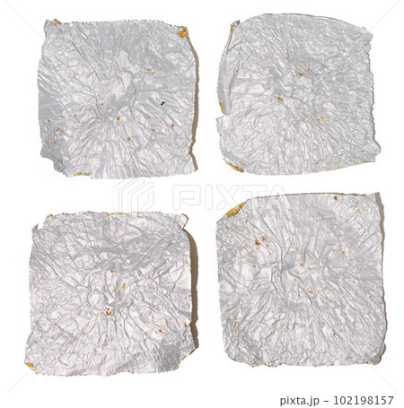 Fragments of gray foil on a white isolated background, top view 102198157