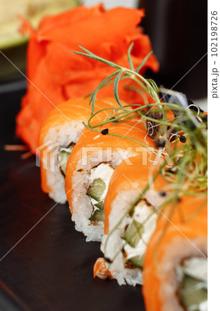 Sushi Philadelphia on a stone decorative plate Sushi Philadelphia on a stone decorative plate 102198726