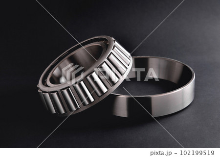roller bearing on a black background close-up, blur as an artistic device roller bearing on a black background close-up, blur as an artistic device 102199519