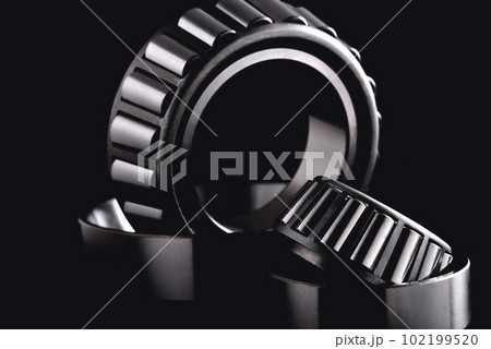 roller bearing on a black background close-up, blur as an artistic device roller bearing on a black background close-up, blur as an artistic device 102199520