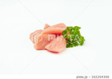 Raw pieces of meat on a white background.Fresh pieces of turkey meat.Raw chicken. 102204300