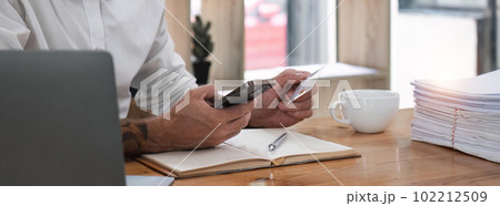 Man using mobile smart phone and credit card making online payment with mobile phone. Online shopping concept 102212509
