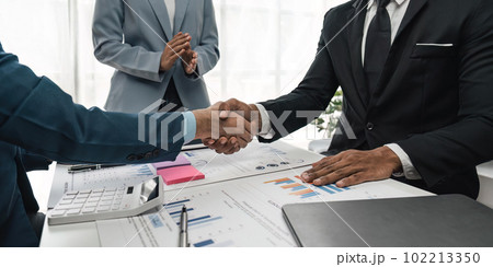 business people partnership shaking hand during a meeting in the office, success, dealing, greeting and partner concept 102213350