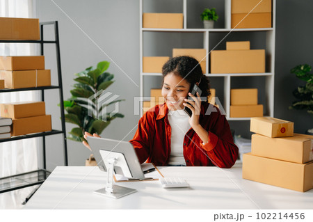 Small business entrepreneur SME freelance African woman working at office, BOX,tablet and laptop online, marketing, packaging, delivery, e-commerce concept Small business entrepreneur SME freelance African woman working at office, BOX,tablet and laptop online, marketing, packaging, delivery, e-commerce concept 102214456