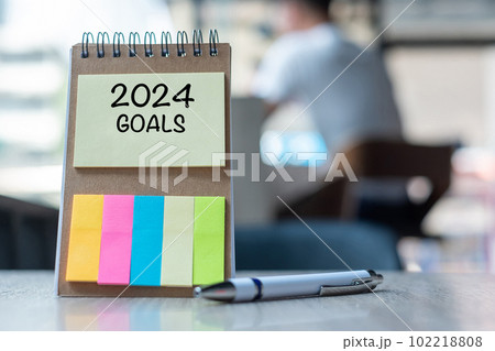 2024 Goal word on note paper with pen on wooden table. Resolution, strategy, solution, goal, business, New Year New You and happy holiday concepts 102218808