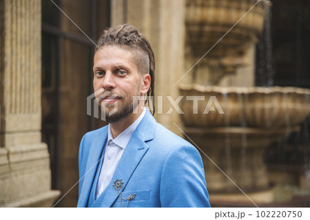 Portrait of a young successful businessman outdoors, look at camera 102220750