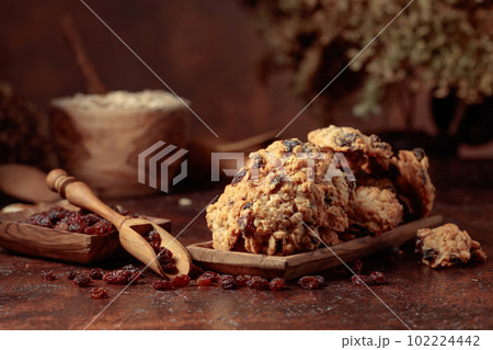 Oatmeal raisin cookies on a brown table. 102224442