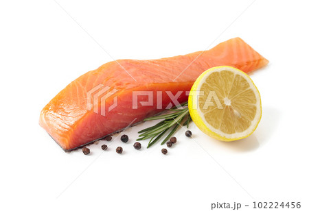 Salmon piece with rosemary, lemon, and peppercorn isolated on a white background. Salmon piece with rosemary, lemon, and peppercorn isolated on a white background. 102224456
