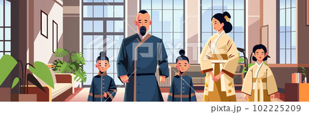asian parents with little children in traditional clothes standing in living room happy family parenthood concept asian parents with little children in traditional clothes standing in living room happy family parenthood concept 102225209