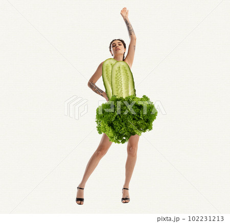 Slim, beautiful, young girl in cucumber and lettuce clothes over white background. Vegetarian. Contemporary art collage. Slim, beautiful, young girl in cucumber and lettuce clothes over white background. Vegetarian. Contemporary art collage. 102231213